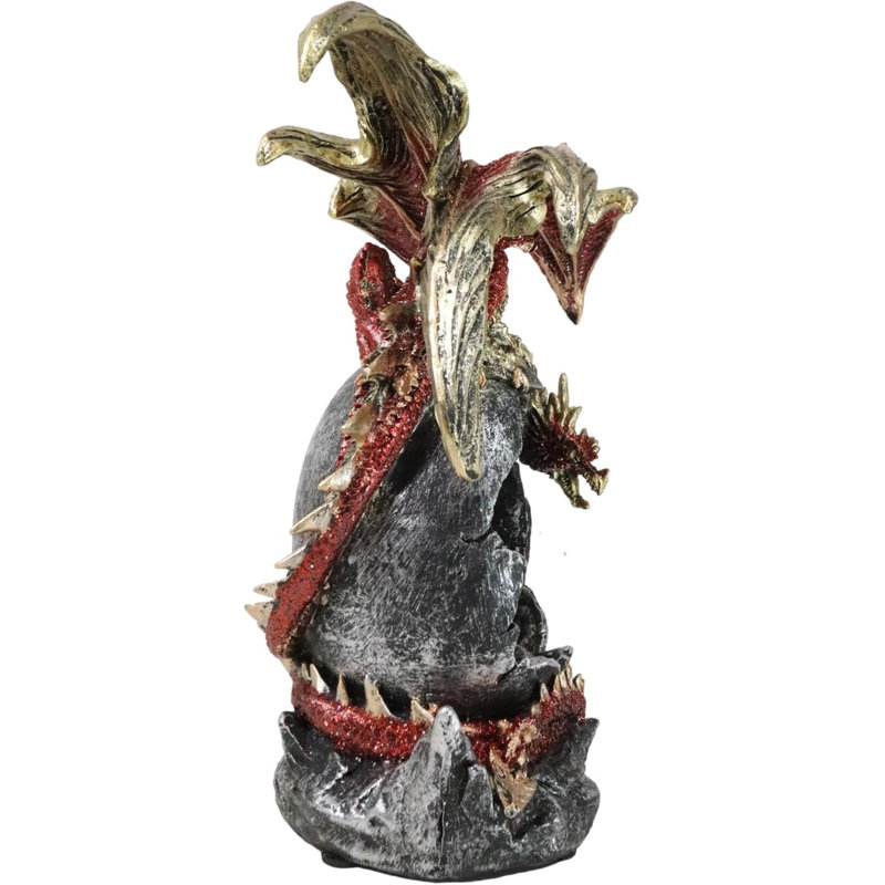 Figurine fantaisie en forme de dragon rouge sur un œuf géant à DEL avec château médiéval