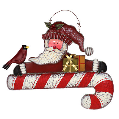 Cadeau de noël oiseau assis sur le cadeau de noël de canne à sucre suspendu