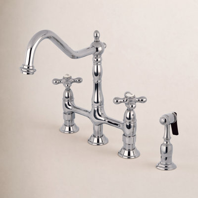 Kingston Brass Heritage Two-Handle 4-Hole Deck Mount Bridge Kitchen Faucet with Brass Side Sprayer