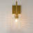 Dimmable Armed Sconce with Prismatic Glass Shade