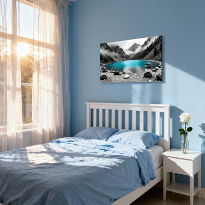 Ensemble de 1 tableau sur toile tendue représentant un lac de montagne aux eaux turquoise et aux pierres empilées