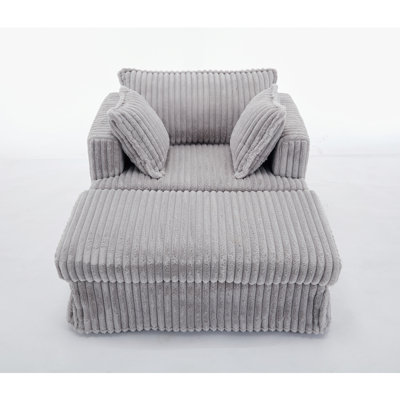 Fauteuil en velours côtelé avec repose-pieds