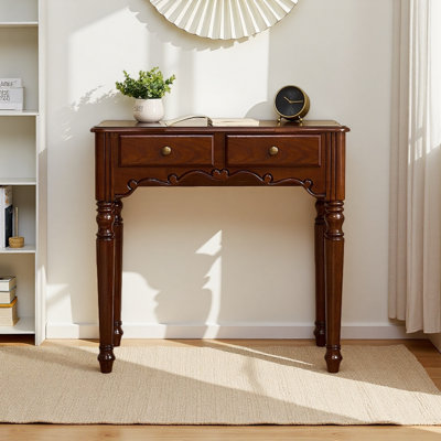 A sturdy rubberwood desk with carved legs