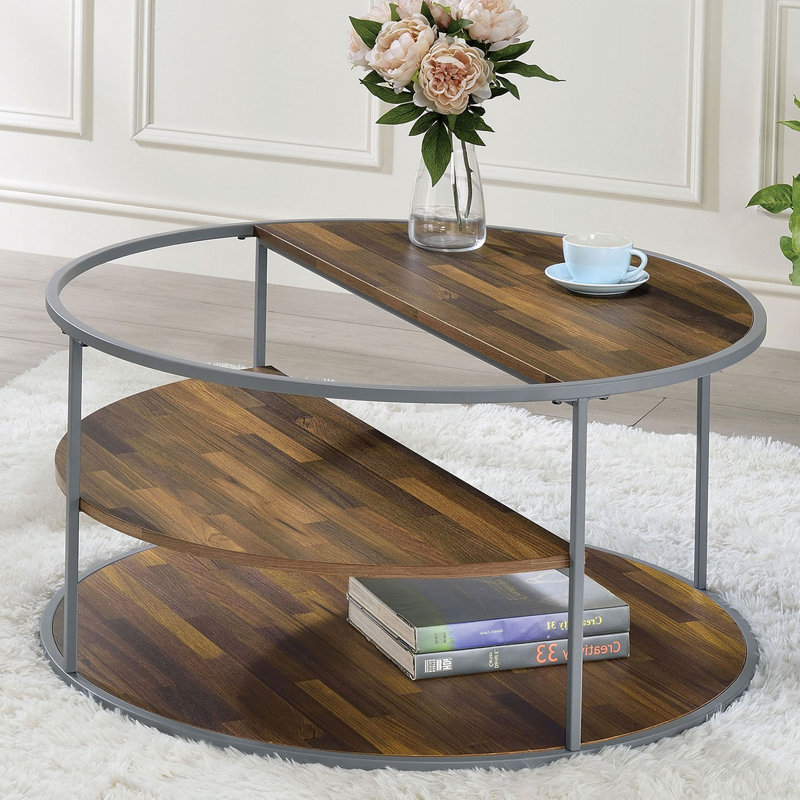 Table basse de style industriel au design unique avec trois tablettes et structure thermolaquée, finition grise et noyer
