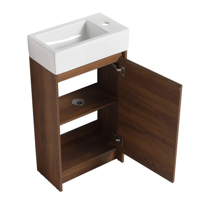 Meuble-lavabo autoportant de 18 pouces avec lavabo simple. Armoire à portes à fermeture douce. Lavabo en céramique longue durée. Caractéristique d'armoire en contreplaqué brun pour salles de bain compactes. Salle de bain