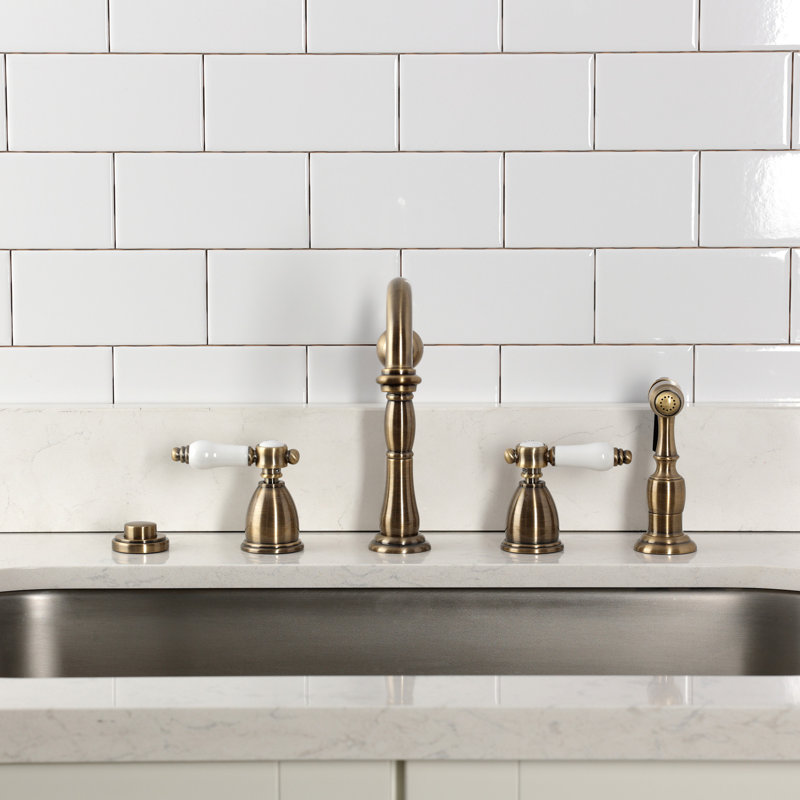 Kingston Brass Bel-Air Double-Handle Widespread Kitchen Faucet, With Side Spray, Antique Brass