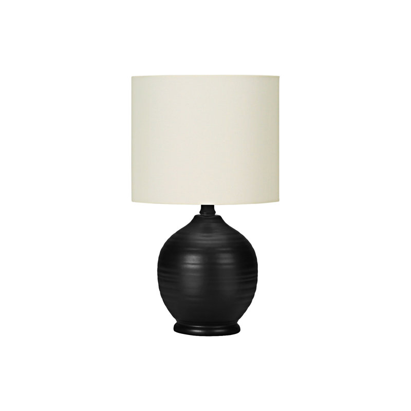 Élégante lampe de table en céramique avec base texturée et abat-jour ivoire en lin chaleureux