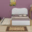 Lit plateforme tapissier avec pieds de soutien en bois et lit gigogne