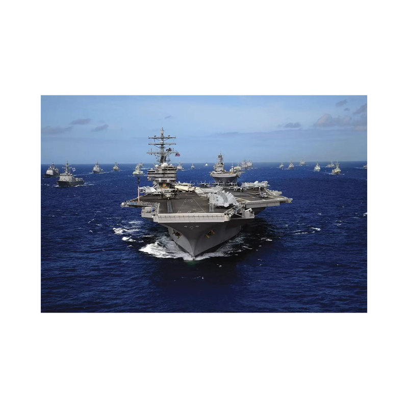 Aircraft Carrier USS Ronald Reagan Leads A Mass Formation Of Ships Through The Pacific Ocean by Stocktrek Images - Wrapped Canvas Print