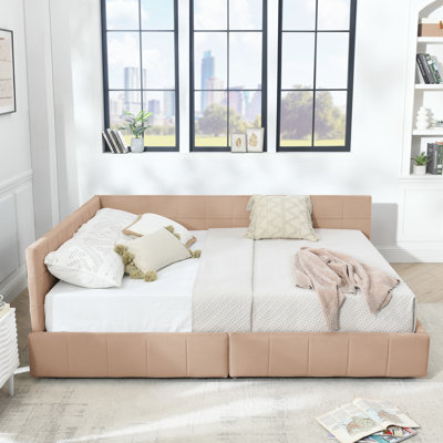 Grand lit confortable, revêtement en velours rose, construction avec rangement pour la chambre à coucher et le salon, structure en bois d'eucalyptus
