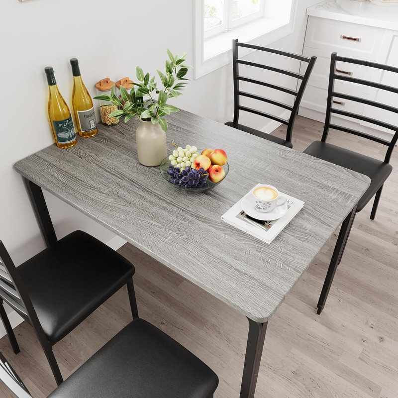 Ensemble de table de salle à manger 4 pièces pour 4 personnes, petite table de cuisine avec 4 chaises rembourrées, conception peu encombrante pour appartement, cuisine, coin repas, plateau de table en bois et structure en métal, finition grise
