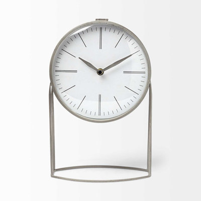 Horloge de table circulaire grise en métal munie d'un mouvement à quartz