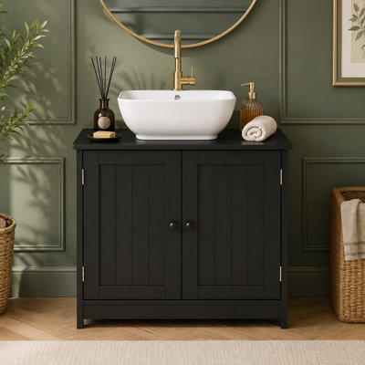 Un meuble-lavabo sur pied de style moderne, installé sous le lavabo de la salle de bain, offre un rangement efficace pour les fournitures de salle de bain.