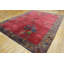 Tapis rouge antique à motif Art déco