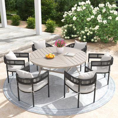 Pascarella Outdoor Patio Dining Set with 60" Round Dining Table and 6 Cushioned Rattan Dining Chairs