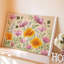 Reproduction d'art sur toile, "Composition florale" mettant en vedette des fleurs délicates roses et oranges, entrelacées avec un feuillage vert-3957917