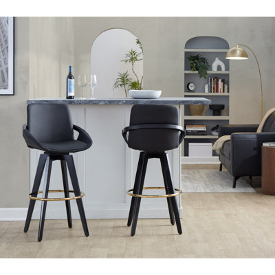 Tabouret de bar à hauteur fixe avec pivot en bois noir et similicuir noir avec repose-pieds rond en métal doré - ensemble de 2