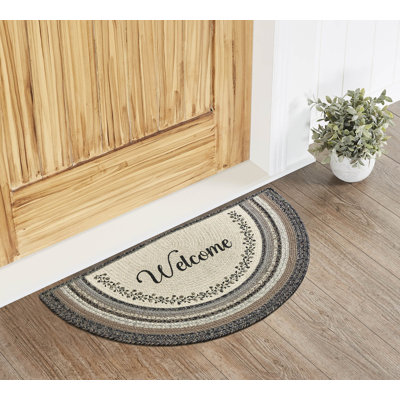 Tapis tressé à la main à motif floral noir / gris Jevontay