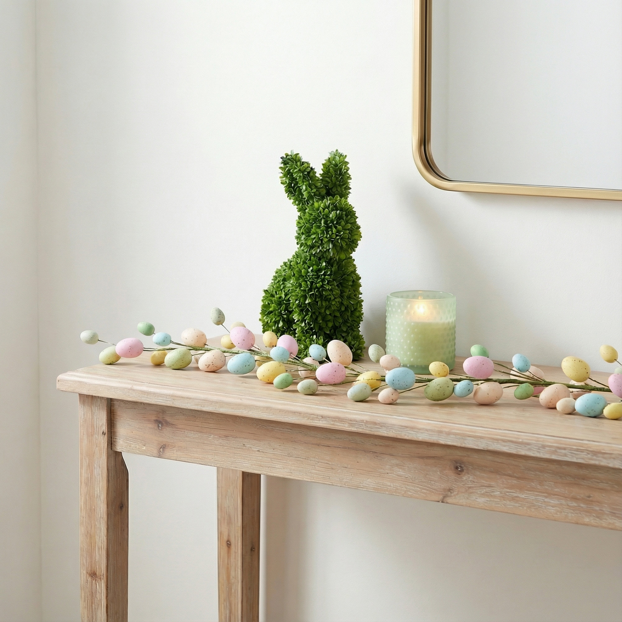 The Holiday Aisle® 52" Artificial Pastel Easter Egg Garland. Features pastel Easter eggs on a wired spine.