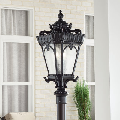 Guzzi 4-Light Textured Black Post Light with Seeded Glass Shade