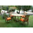 Arnott 4 - Person Teak Solid Wood Patio Dining Set Extendable and Umbrella Hole Included Oval Table and Round Table