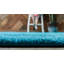 Tapis turquoise Zuniga-559773637