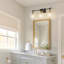 Meuble-lavabo moderne 3 lumières Malinowski avec détails dorés et verre nervuré vertical