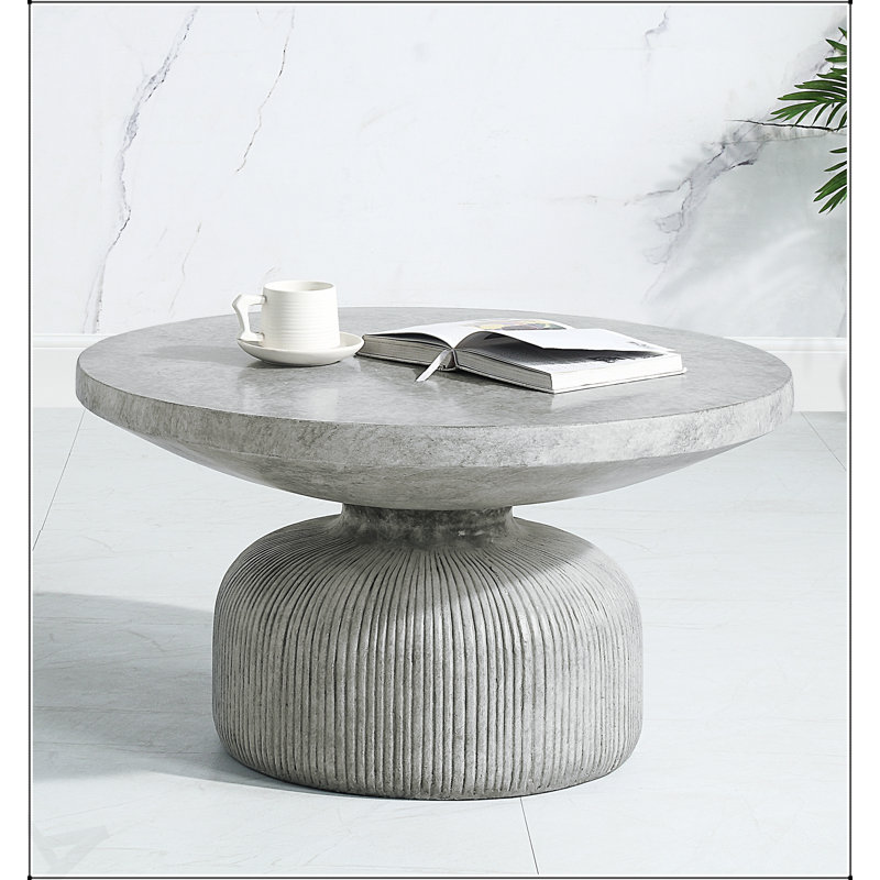 Table basse ronde à finition grise Laddie, parfaite pour les petits espaces et les intérieurs modernes