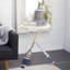 Table d'appoint en métal blanc avec roulettes et pieds en forme de rame