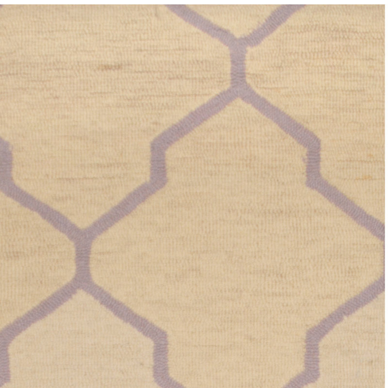 Tapis ivoire en laine touffeté à la main