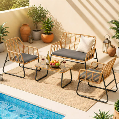 4-Piece PE Rattan Outdoor Seating Group with Tempered Glass Coffee Table