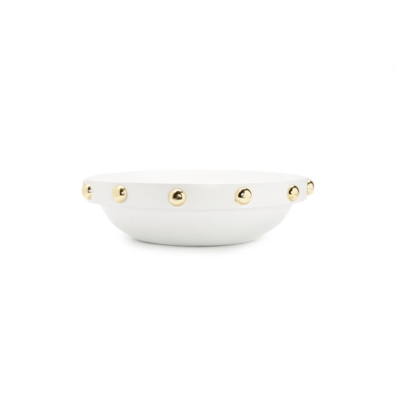 Centre de table blanc avec motif de boule dorée sur une bordure