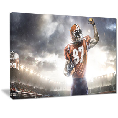 " American Footballer On Stadium "