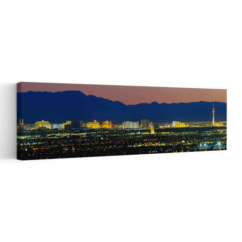 Aerial View Of Buildings Lit Up At Dusk Las Vegas Nevada USA by Richard Sisk - Wrapped Canvas Panoramic Print
