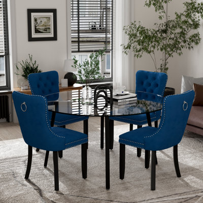 Ensemble de salle à manger rond avec chaises capitonnées