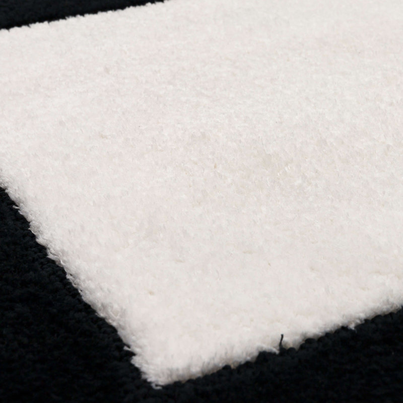 Tapis de bain géométrique en tricot Counterpoint Casual, Noir / blanc, L 17 po x L 24 po