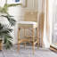 Tabouret de bar rembourré Evins avec structure en bois massif-287898249
