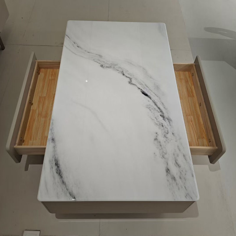 Table basse avec pierre veinée et tiroir à fermeture en douceur