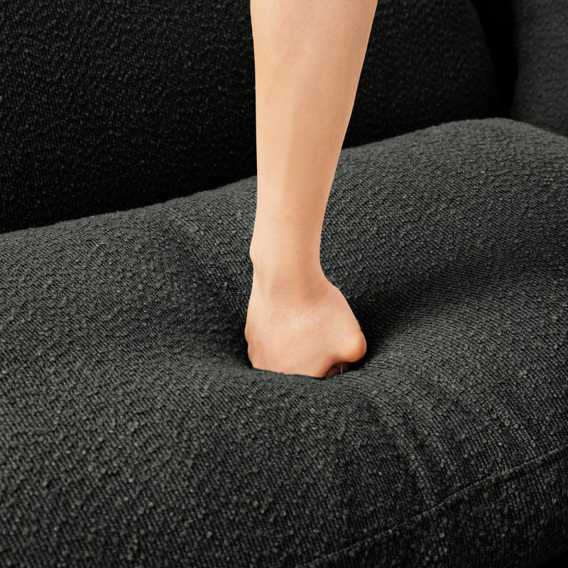 Gris foncé avec style moderne, pieds cylindriques et sièges à ressorts pour un rembourrage relaxant
