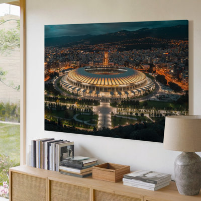 Canvas An Aerial View Captures A Grand Illuminated Stadium At Night Wall Art Showcasing A Modern Design With Sweeping Curved Seating Canvas Wall Art