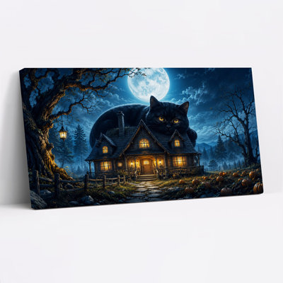 Chat noir géant au-dessus d'une maison illuminée sous la pleine lune - Toile murale d'Halloween