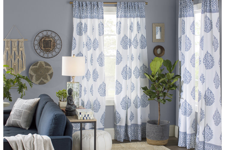 coastal living room with white and blue patterned curtains