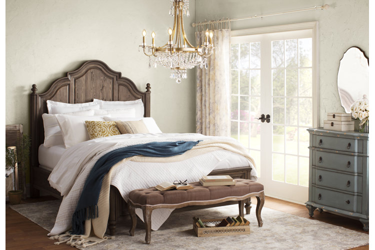 french country bedroom with french doors leading to the exterior