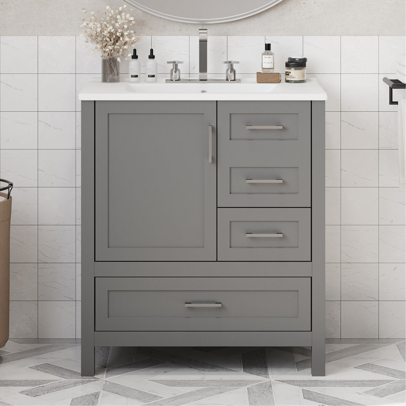 Meuble-lavabo de 30 po avec lavabo - Finition grise. Bois massif et rangement spacieux. Fonction de fermeture en douceur. Luminaire de construction moderne. Vaste espace de tiroir. Fermeture silencieuse. Poignées argentées élégantes. Céramique