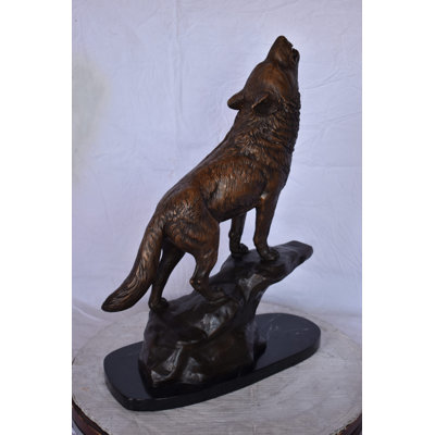 Howling Wolf At Edge Of A Cliff Bronze Statue - Size: 9"L X 20"W X 26"H.