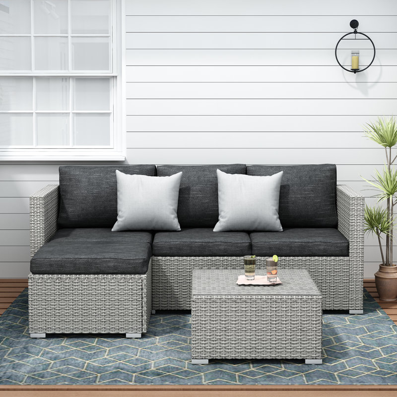 Ensemble modulaire 3 pièces en osier avec coussins et plateau en verre Southerland, Gris / noir