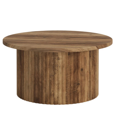 Élégante table ronde au centre, canapé, table d'appoint et table basse