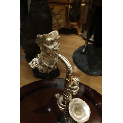 Hereford Man Playing Trombone Bronze Statue -  Size: 8"L x 5"W x 14"H.