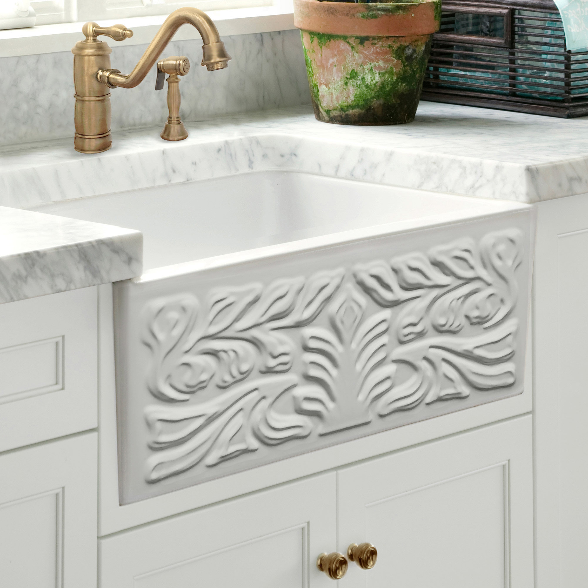 https://assets.wfcdn.com/im/96014826/compr-r85/2619/261999897/gothichaus-fireclay-30-x-18-sink-with-a-swirl-design-front-apron-and-a-fluted-front-apron.jpg
