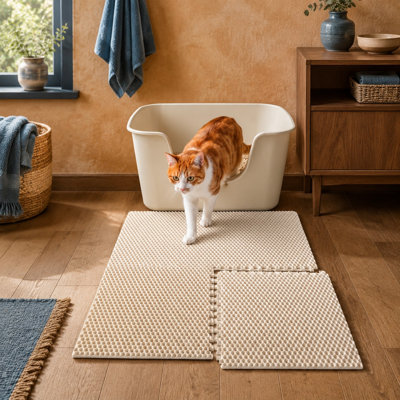 Tapis de litière extensible de type casse-tête, vendu en lot de 4, mesurant 25,2 x 25,2 pouces une fois assemblé et composé de sections de 12,6 pouces ; les pièces alvéolées retenant la litière sont fabriquées en EVA imperméable, faciles à nettoyer et peuvent être découpées sur mesure.